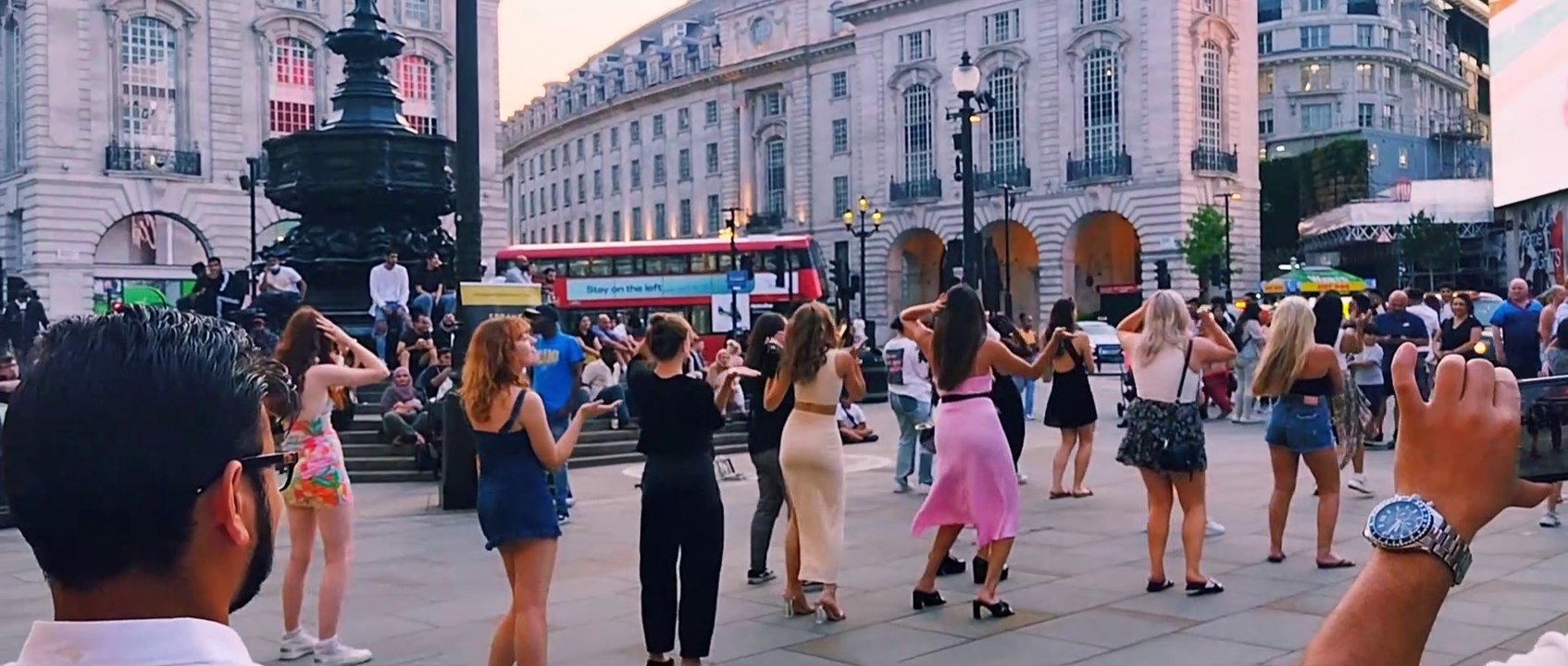 Girls dancing in the streets of London, at the top of magnificence