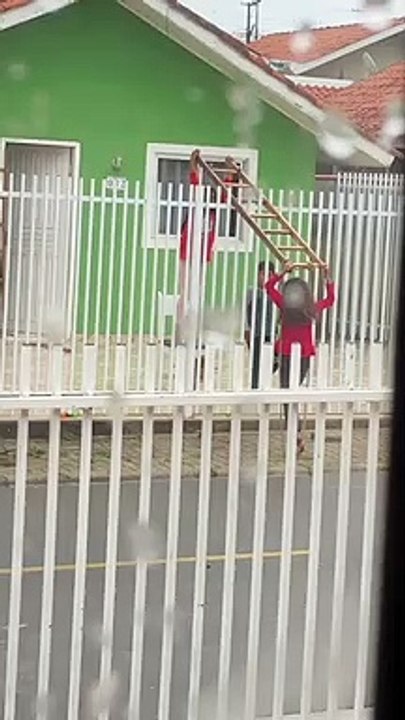 Kids Create Teeter-Totter Using Fence and a Ladder