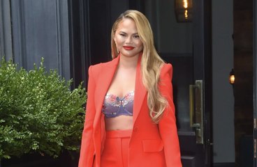Chrissy Teigen Wore a Floral Bra Under a Bright Red Suit