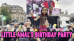 'LARGER-THAN-LIFE Syrian puppet enjoys her birthday party in Trafalgar Square'