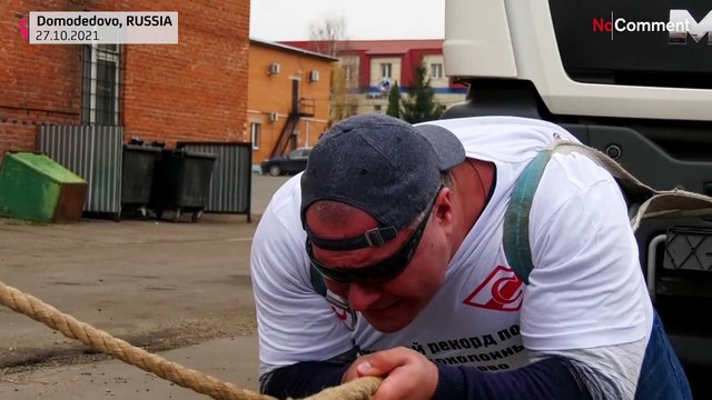 Russian Hulk sets world record hauling 53 tonnes of lorry and bus
