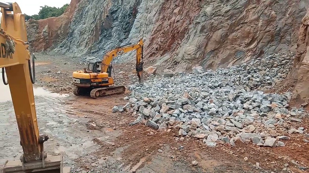 Rock breaking By JCB machine