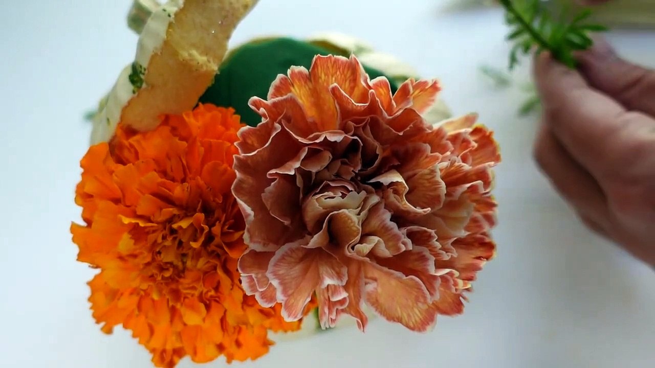 Carnation and Marigold Pumpkin Arrangement