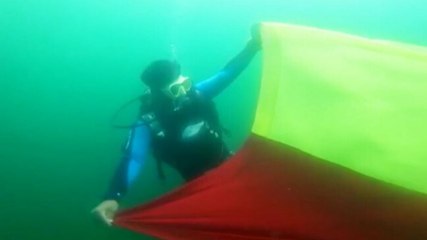 Image of the day: Divers unfurl 20-foot-long Karnataka flag under water to mark Rajyotsava