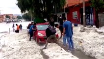 Severe hailstorm floods streets of Bolivian city