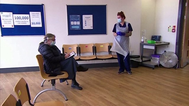 NHS workers give out booster jabs as Covid-19 cases rise