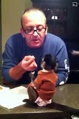 Baby Gaitlyn 6m old December 3 2012 with her paw paw having fish her brother cooked! Gaitlyn is not much of a seafood ea