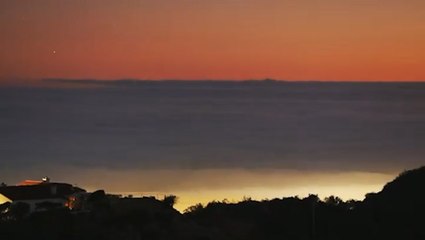 The sun sets and the stars come out in stunning foggy timelapse