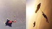 'Rope Climber hangs on to rope tied to Wingsuiter *EPIC mid-air stunt*'