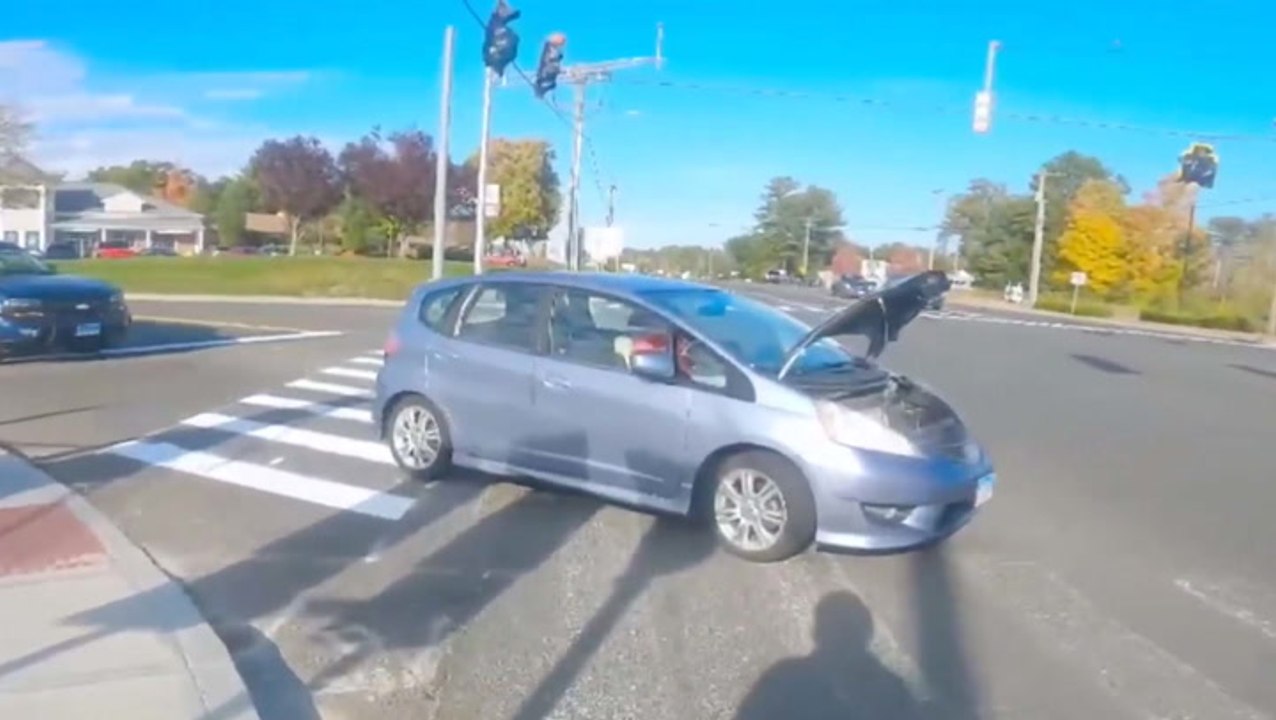 Biker Lends Broken Down Driver A Helping Hand