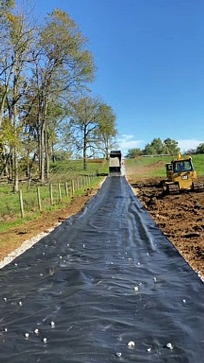 Dump Truck Back Spreading Gravel