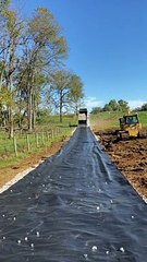 Dump Truck Back Spreading Gravel
