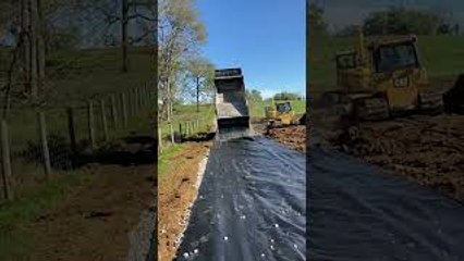 Dump Truck Back Spreading Gravel