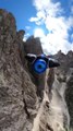 Person Does Wingsuit Base Jumping in the Dolomite Mountains in Italy