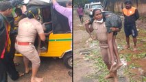 Chennai Rains: Policewoman Carries Unconscious Man | Oneindia Telugu