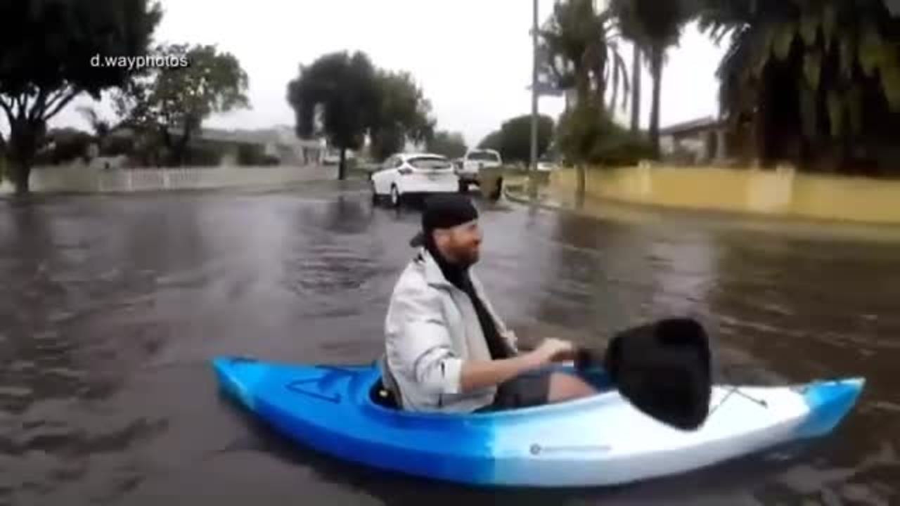 Men Try 'Urban Kayaking' on Flooded Ventura Streets