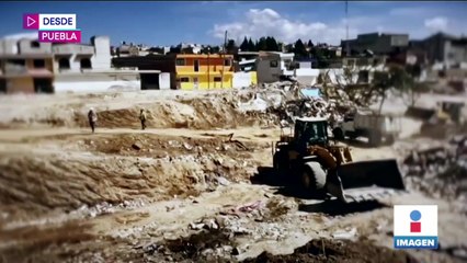 Demuelen viviendas afectadas tras la explosión en Puebla