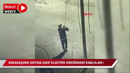 Download Video: Arkadaşının sırtına çıkarak elektrik direğindeki kabloları çaldı