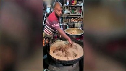 Viral video of man frying chicken using bare hands