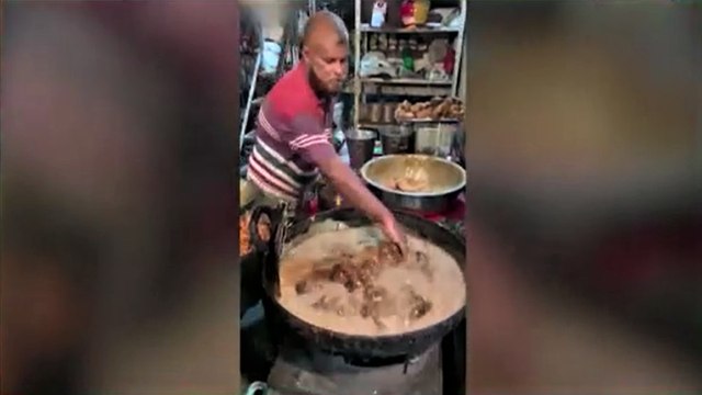Viral video of man frying chicken using bare hands