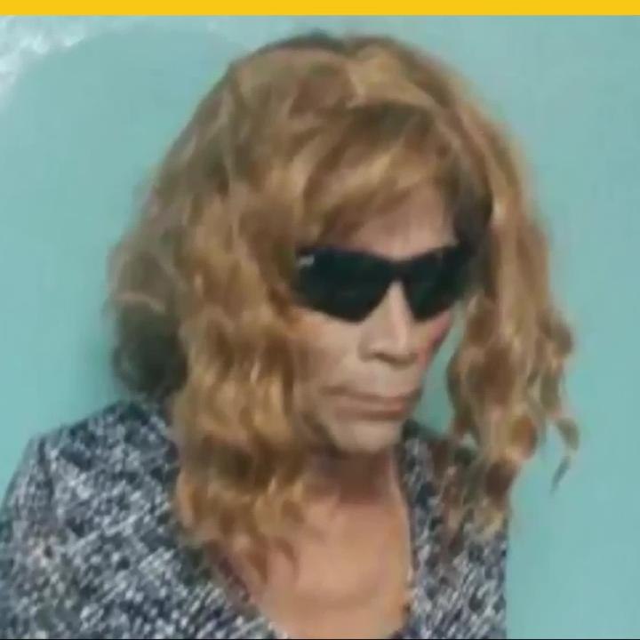 Intenta escapar de prisión vestido de mujer.mp4