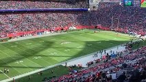 Parachuters enter Empower Field prior to Broncos-Eagles game