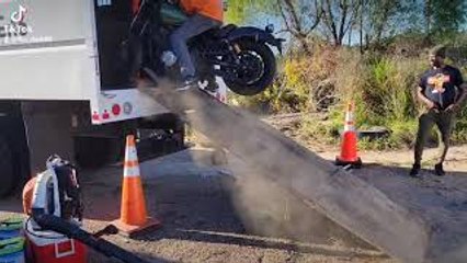 Man Loading Motorcycle Fails