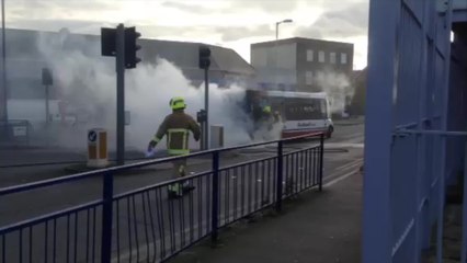 Bus bursts into flames in town centre
