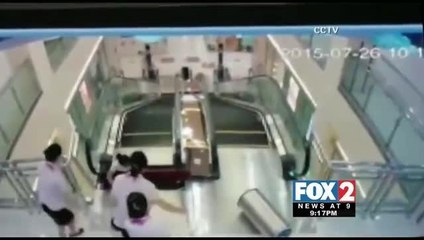 Woman Saves Child before Falling to Death down Escalator Shaft