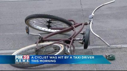 Cyclist hit by taxi driver