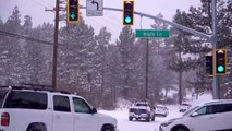 Cars sliding on Maple Lane after recent snowfall in Big Bear, CA