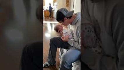 Infant Lifts Head for Nose Kisses