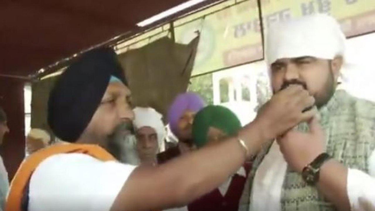 Farmers in Chandigarh celebrate after repeal of...