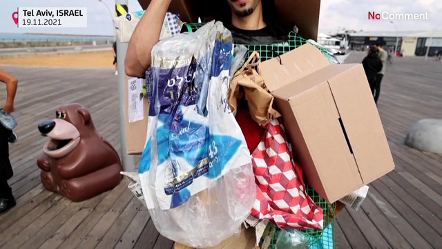 Activists denounce fast fashion in plastic catwalk protest in Tel Aviv