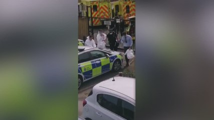 Officers at the scene in forensic gear