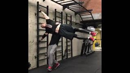 Two Men Complete an Impressive Human Flag Stunt
