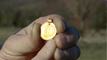 Mystery gold pendant discovered by couple near Herne Bay
