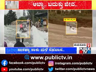 Bike Rider Swept Away By Floods; Holds A Tree Log and Saves His Life | Tumkur