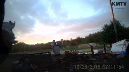 Men caught on camera dumping rubbish on the side of the road.