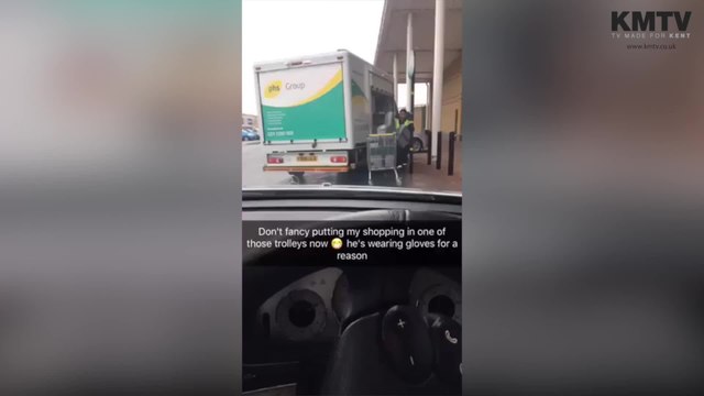 Man uses trolley to move sanitary bins