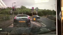 Dashcam captures car driving on the wrong side of the road