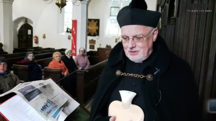 Father Colin Johnson braves the cold at church
