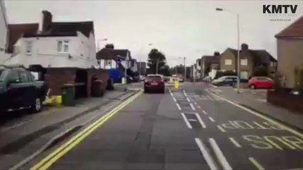 Dashcam footage shows cyclist ride on back wheel