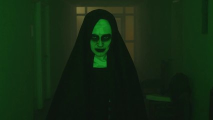 Creepy ghost nun walking looking at the camera