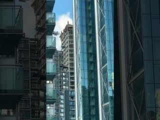 Shattered Window Pane Showers Glass Onto Street Below