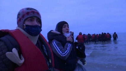 More than 40 migrants filmed crossing Channel as French police watch from beach
