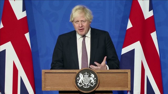 Boris Johnson announces mandatory PCR tests and isolation for international travellers and face masks in public spaces to halt spread of Omnicron variant