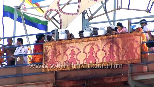 Jain devotees pour milk over the monolithic statue of Bahubali _ Mahamastakabhishek, Karnataka