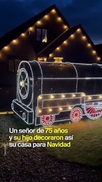 Papá e hijo adornan casa con un expreso polar hecho de luces