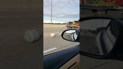 Truck Driving on Interstate Dragging a Propane Tank